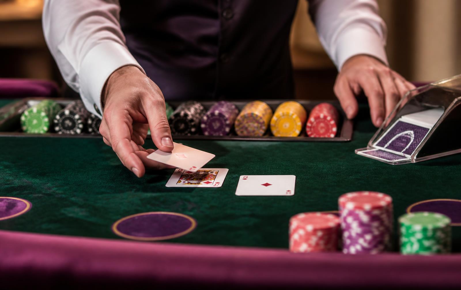 Casino trainee dealing cards at a Swissbirch practice table